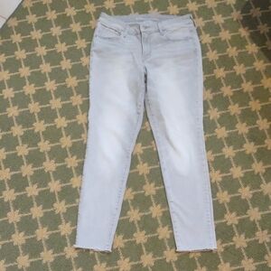 Rockstar Raw Hem Light Gray Silver Stretch Skinny Jeans